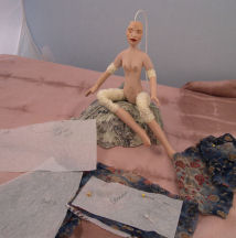 stringing doll parts made of air dry slip