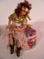 gypsy doll holding a baby