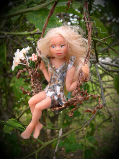 Girl Fairy in a tree swing