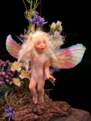 tiny fairy in fairy garden