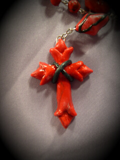 red gothic cross made from polymer clay and push molds